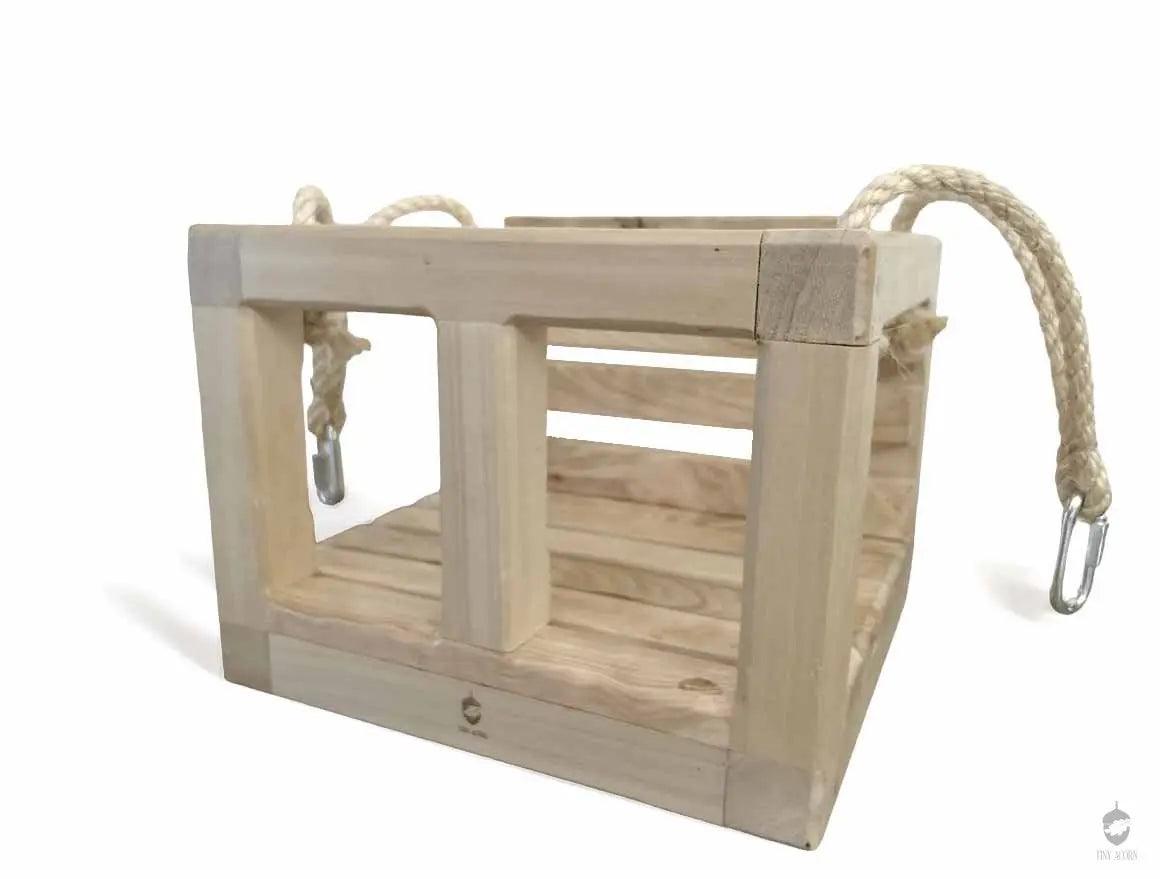 unique wooden timeless handmade swing for children.  sustainable children swing.  wooden swing.  durable kids handmade swing